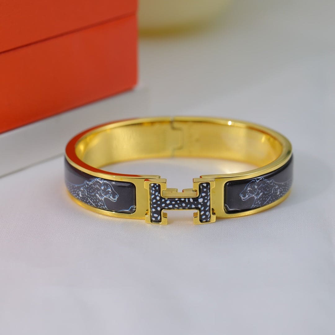 18K Hermes Guepards Clic Clac Bracelet