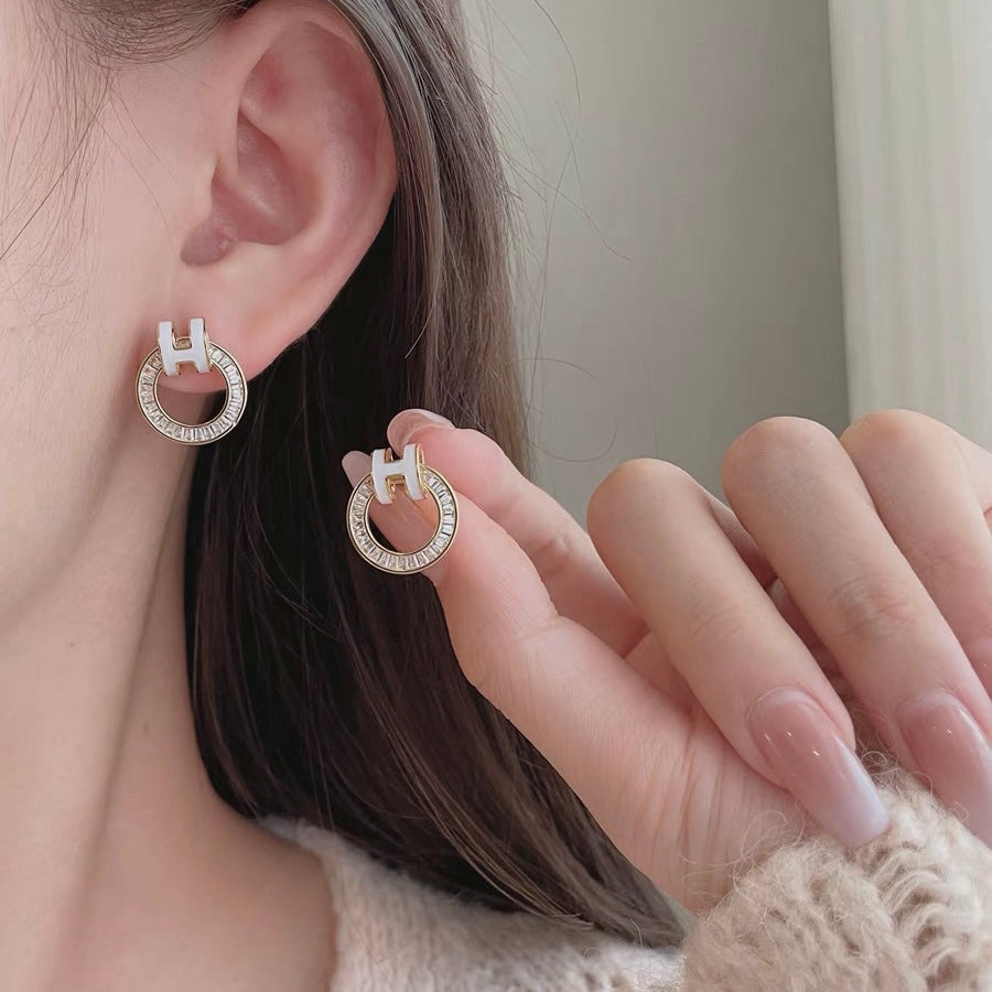 18K Hermes Clic Diamond Earrings