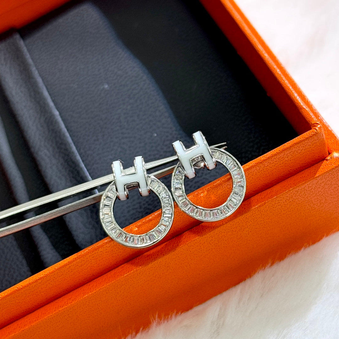18K Hermes Clic Diamond Earrings